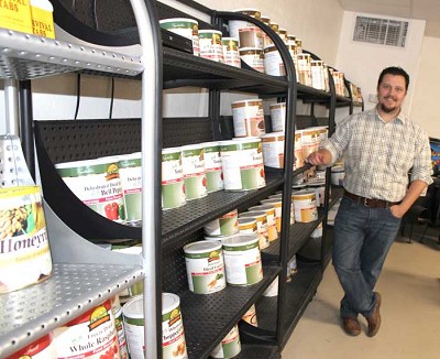 Gaylon Cornsilk and his store Red Dawn, located at 6103 SE 15th Street, offer a variety of survival products and even classes to teach skills like canning and candle making. (Photo by Vicki Middleton)