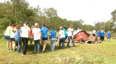 CHS students work together to clean up one of two properties in the Bethel Acres area. (Photo provided)