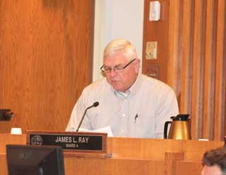 James Ray, Ward 4 councilmember, reads one of the motions regarding Midwest Regional Medical Center Tuesday. (Photo by Vicki Middleton/EastWord News)