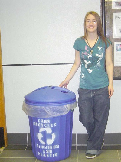 Stokes shows off one of her recycling bins at Carl Albert High School.