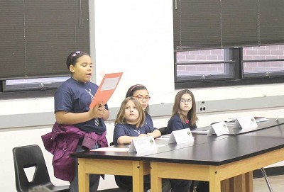 Lindsey Cooper, a fourth grader from Sooner Rose Elementary, represents her school in a debate competition Saturday, Feb. 1 when 29 teams from 17 schools filled Midwest City High School. (Photo by Joel Dean)