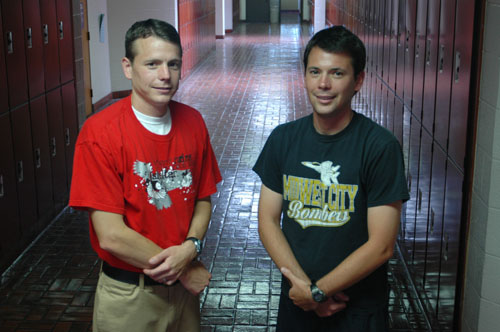 Kacey (left) and Mylo Miller don T-shirts supporting schools where they teach. Photo/Kelley Chambers