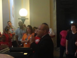 Representative Mike Shelton urges crowd to lobby legislators to adequately fund public education